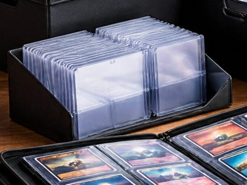 Clear top loaders standing in a black card storage tray